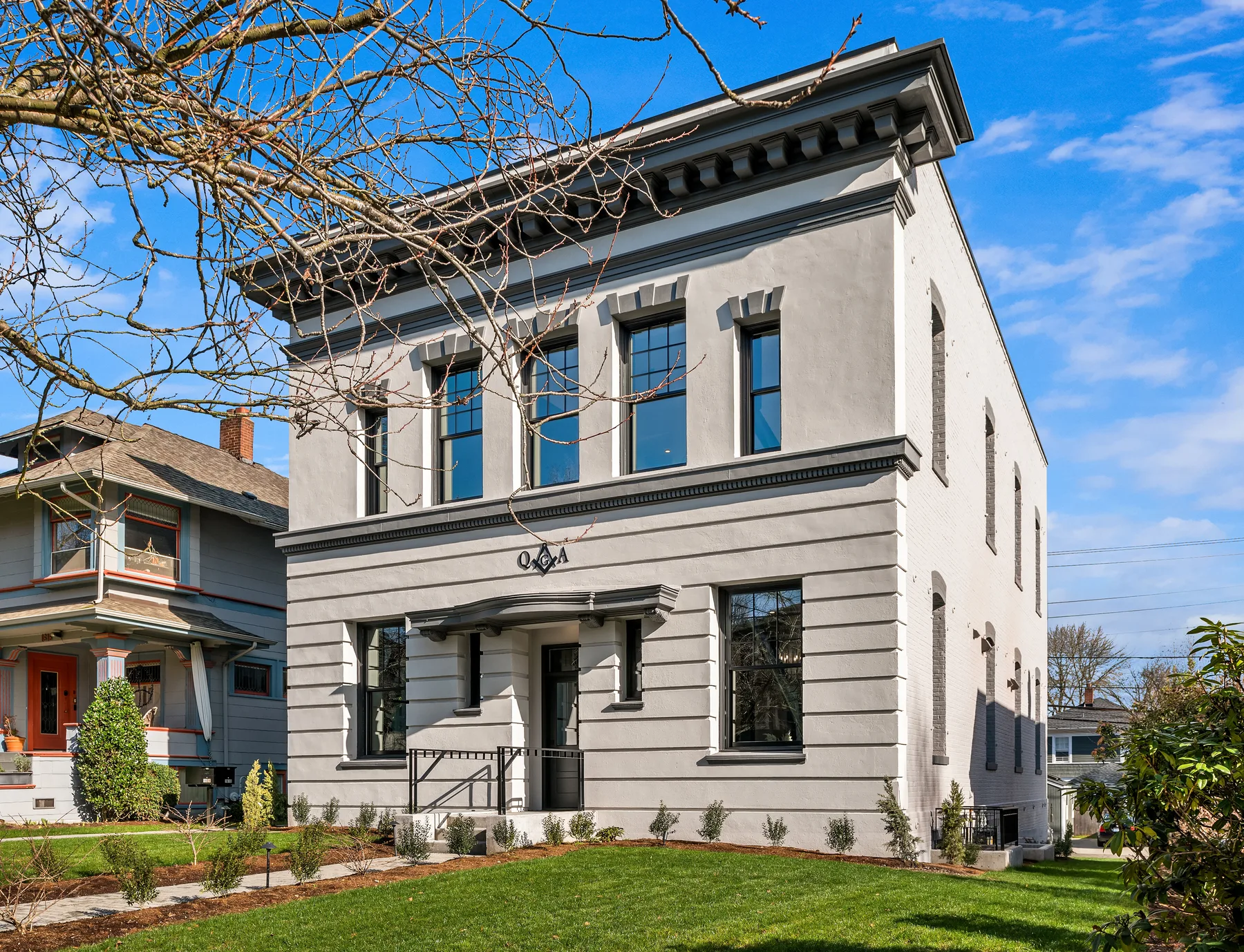 Restored historic Masonic Temple with a classical stucco façade in Seattle, staged by RD Interiors